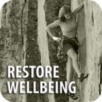 Restore wellbeing with photo of a woman wall-climbing with Restore Balance.